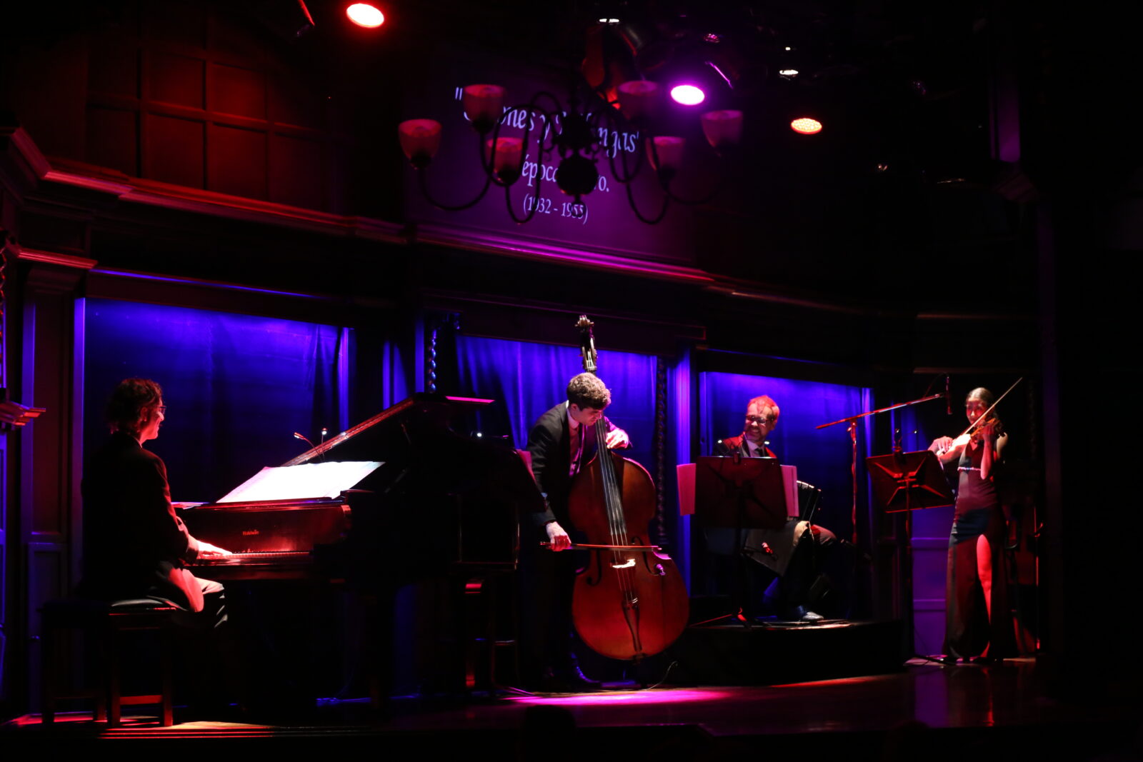 Tango orchestra quartet in Buenos Aires from El Querandí performing live music on the San Telmo stage.